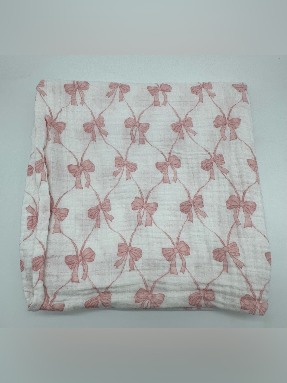 Mud Pie Muslin Swaddle Blanket in Pink Bow Print